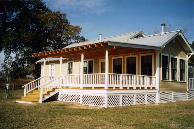 Full-width porch addition on a country farmhouse